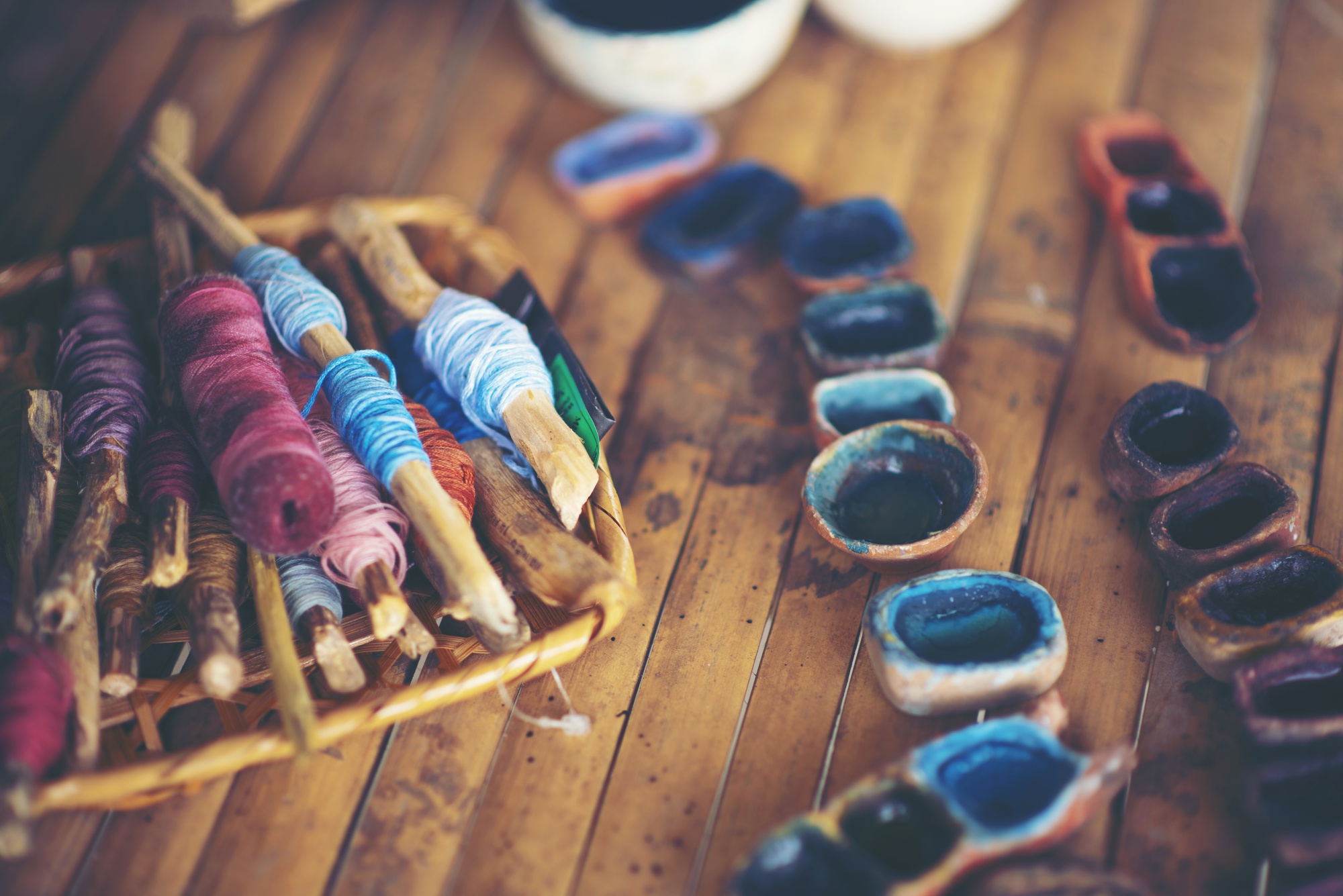 workbench with threads, hoops and sketches